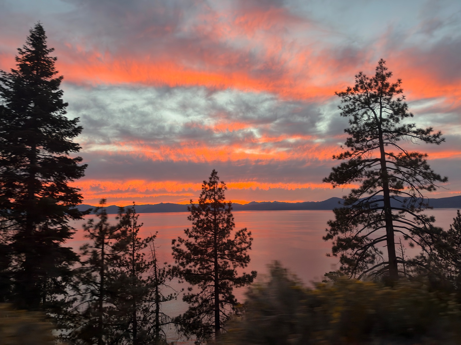 6:46 pm. Orange and pink sky over Lake Tahoe.